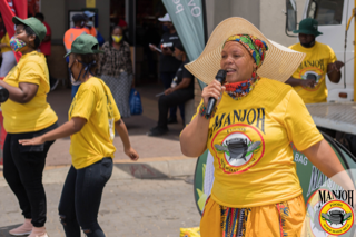 Mama Manjoh serving meals